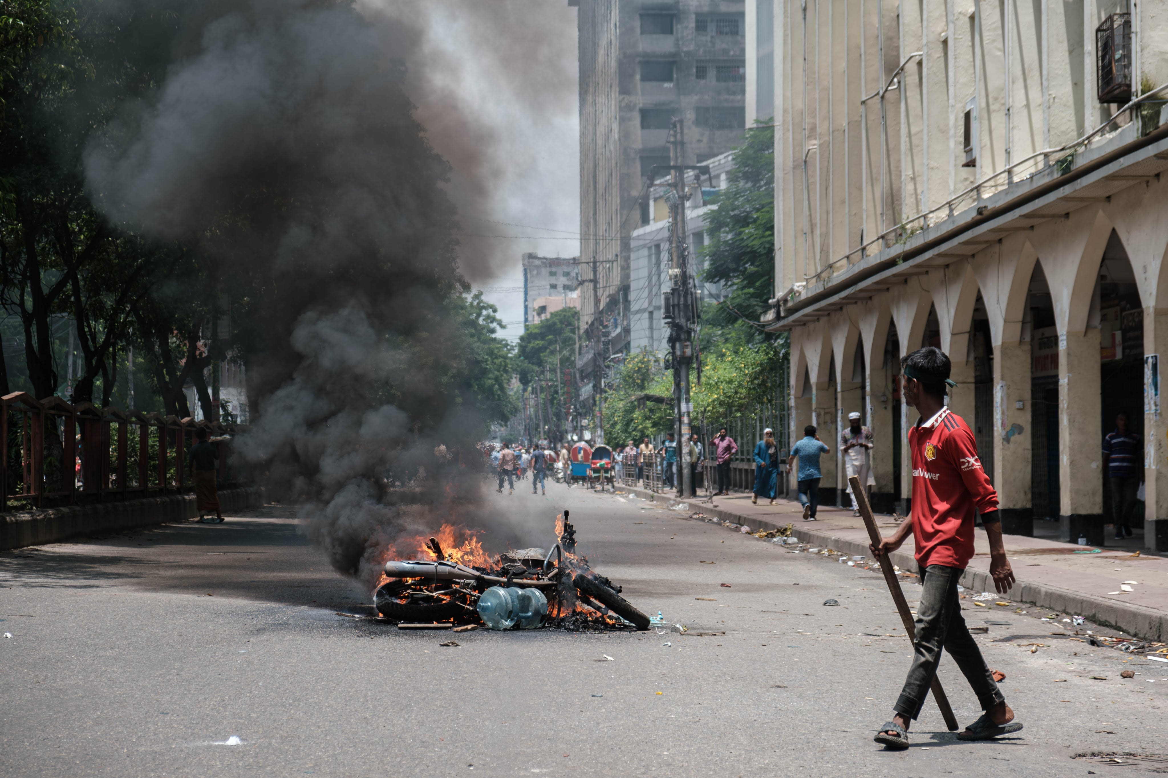 A burning police motorcycle due to the civil disobedience in Bangladesh demanding the government's resignation. Image Credits: Abul Hayat Rahadh.