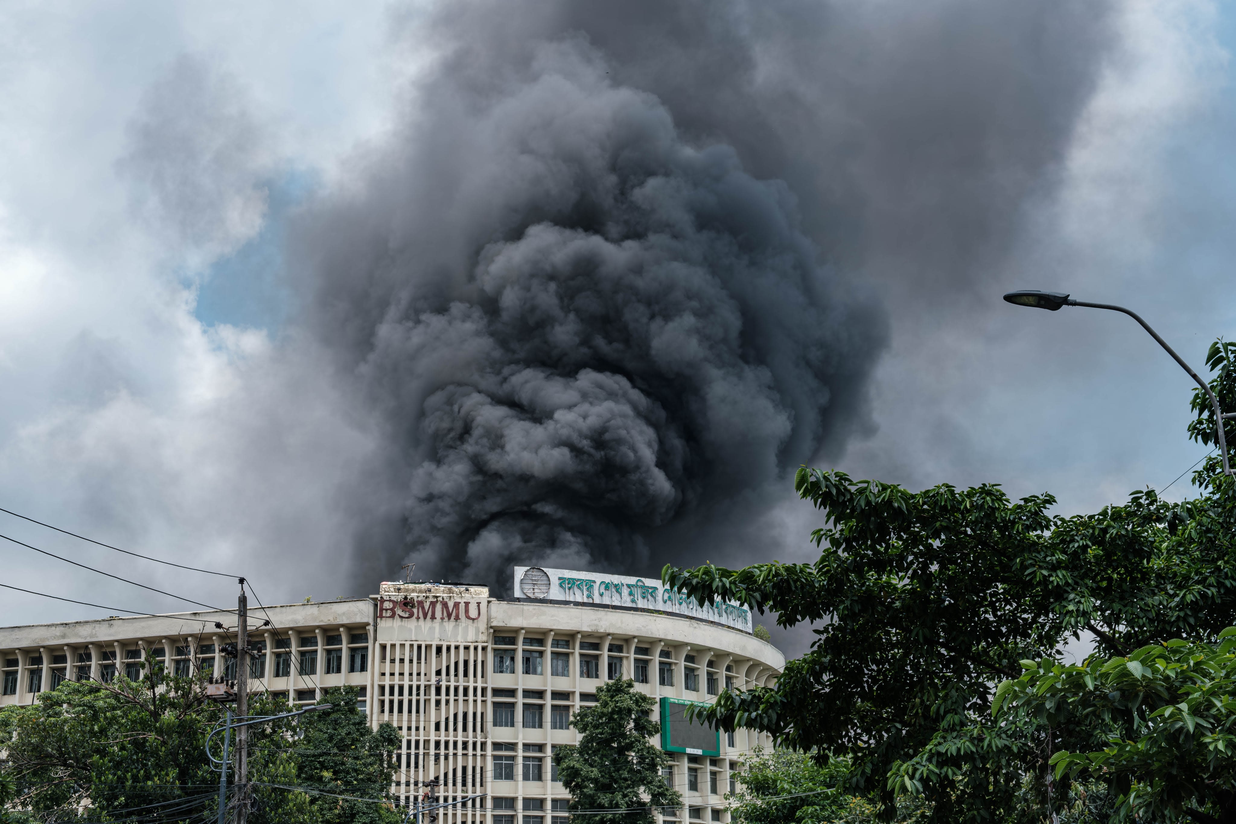 Protesters burning a government building during the overthrow of Sheikh Hasina's Awami League government in Bangladesh on 5 August 2024. Image Credits: Abul Hayat Rahadh. Image Credits: Abul Hayat Rahadh.
