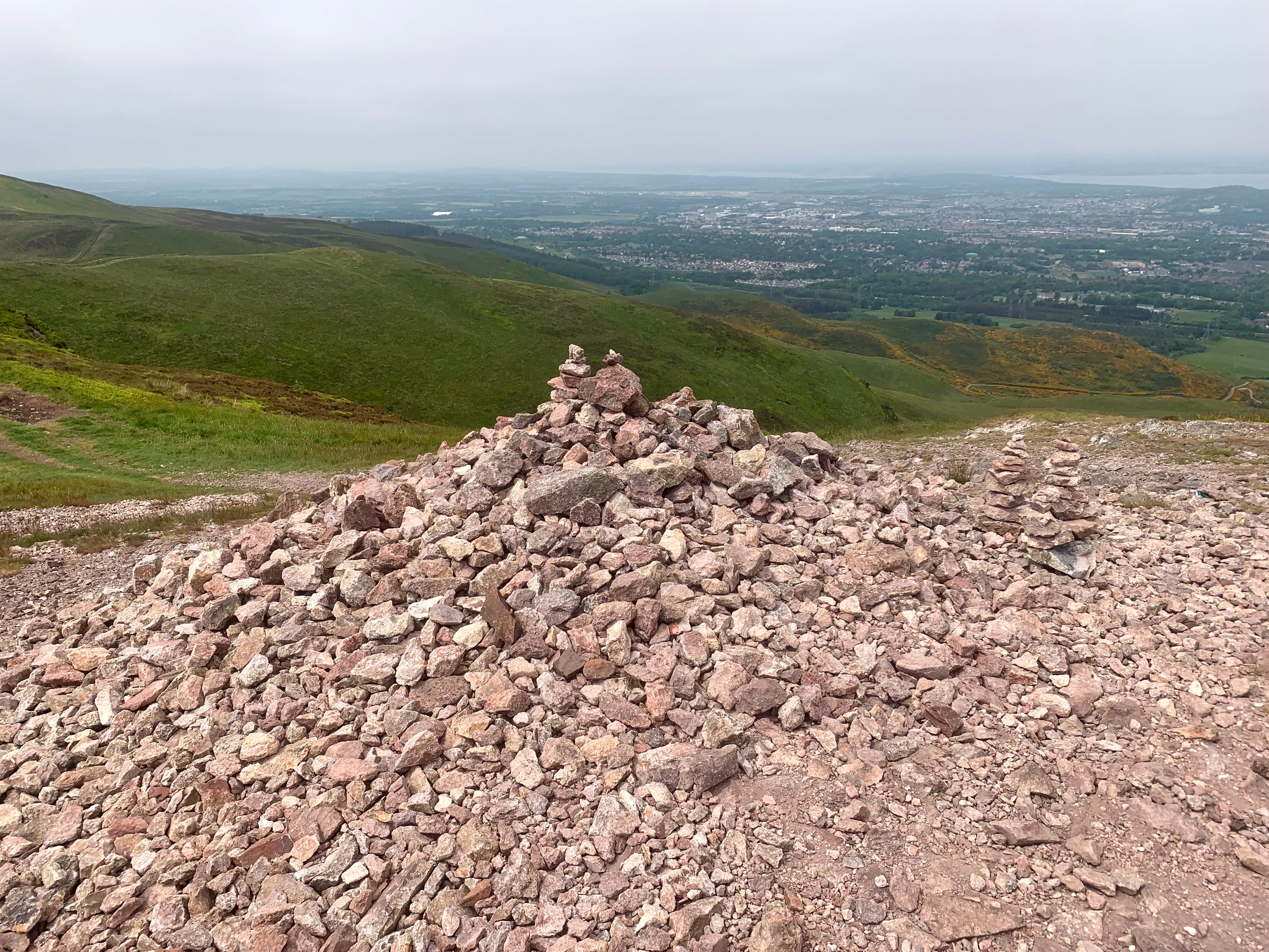 A mound of stones on top of a hill